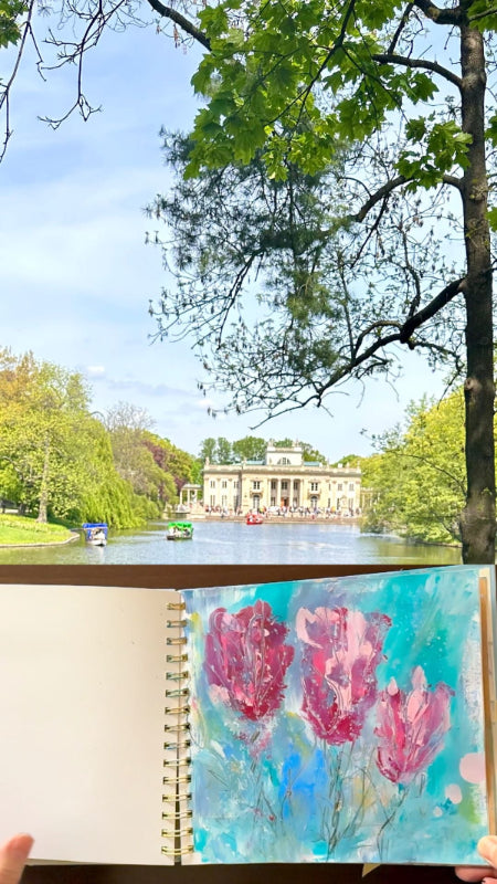 A painting in a journal by the lake 